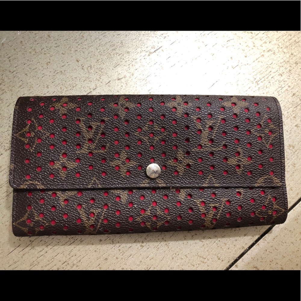 Louis Vuitton perforated fuchsia wallet
